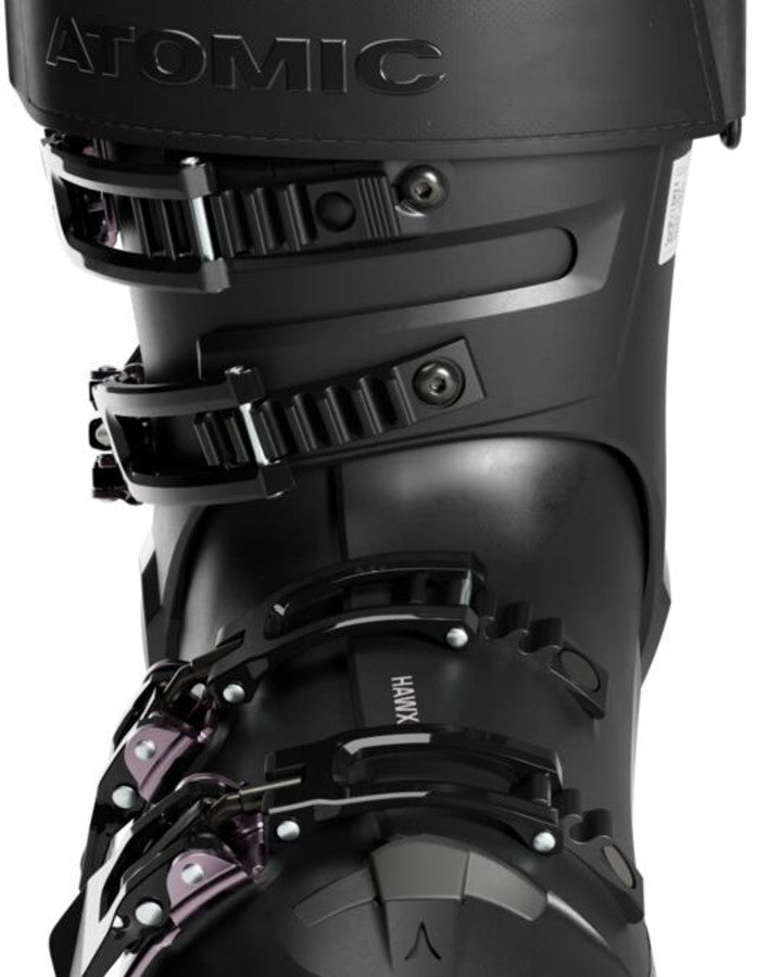 Load image into Gallery viewer, Close-up of the black shell, buckles, and power strap on an Atomic Hawx Magna 105 S W GW ski boot.
