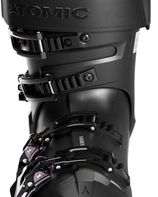 Close-up of the black shell, buckles, and power strap on an Atomic Hawx Magna 105 S W GW ski boot.