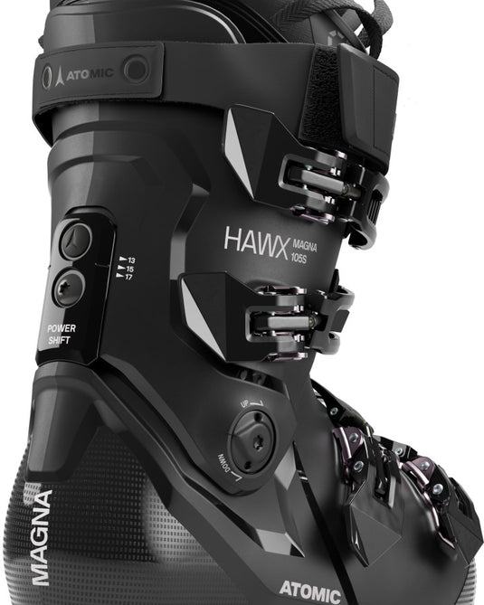 Atomic Hawx Magna 105 S W GW black ski boot showing Power Shift adjustment, buckles, and branding from a side angle.