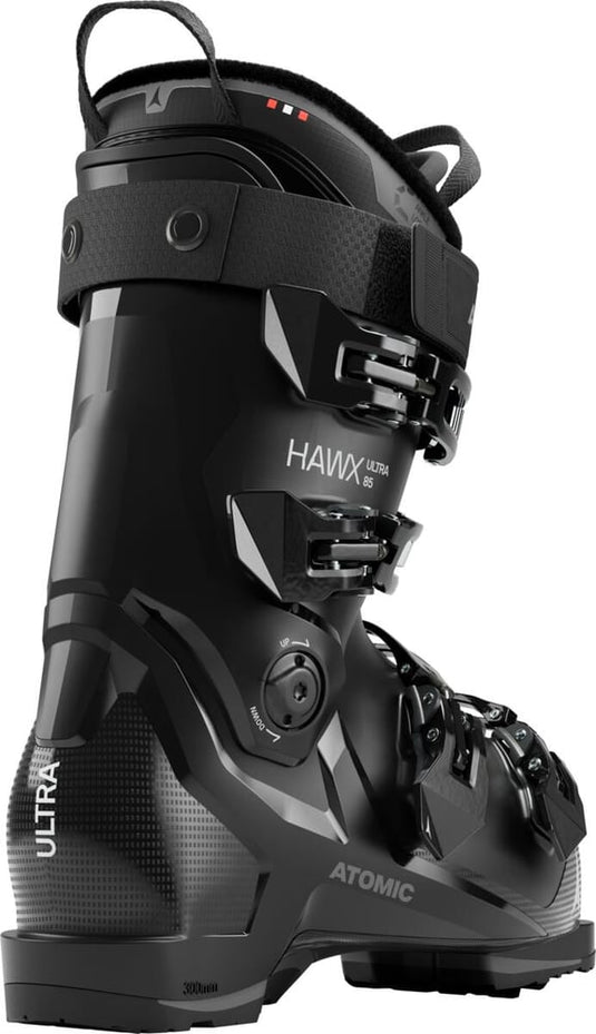 Black Atomic Hawx Ultra 85 W ski boot from a rear angle, featuring four buckles, power strap, and textured heel design.